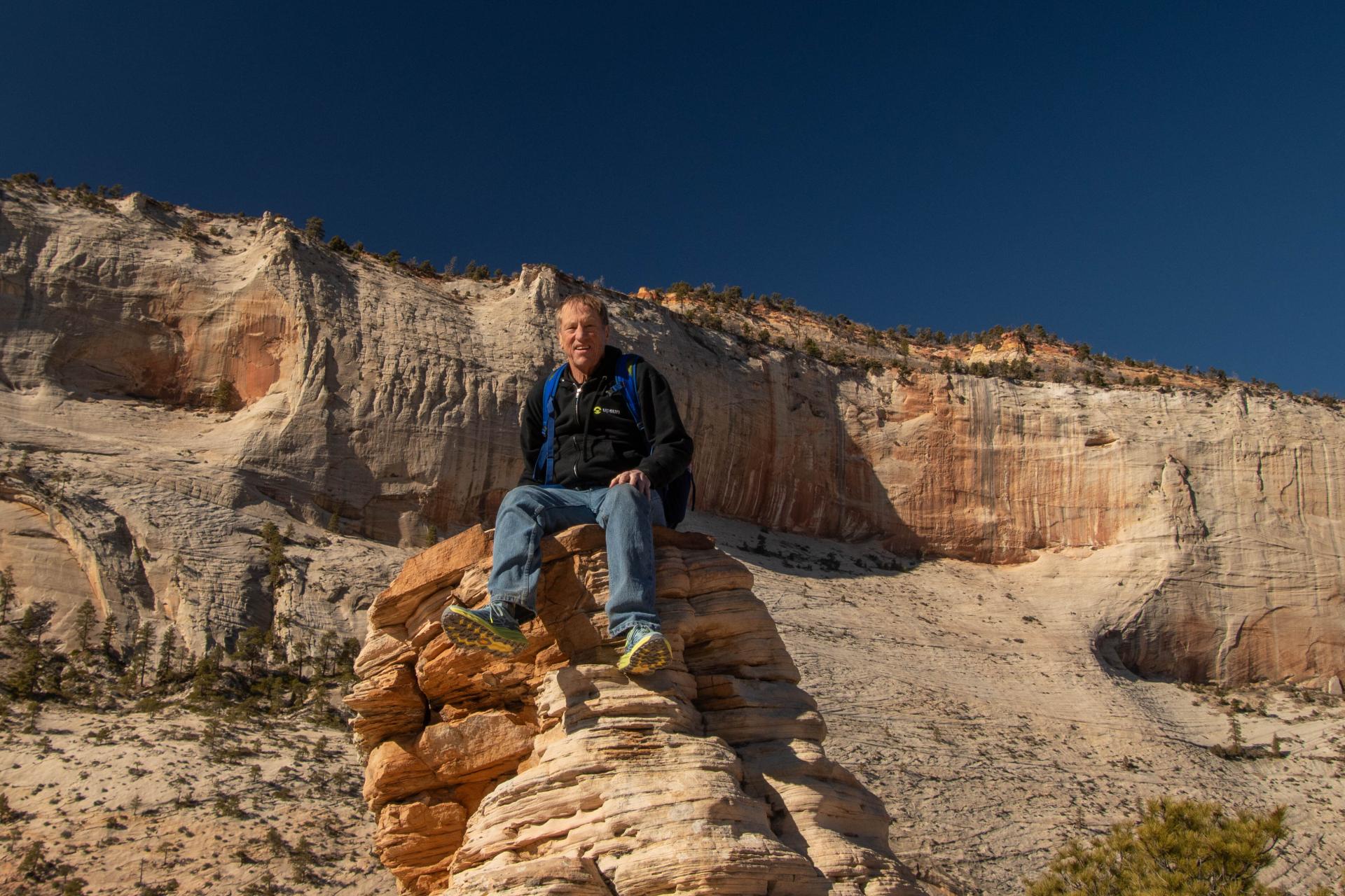 In love with the dreaded mountain path! Randy Fay on a hillside. 