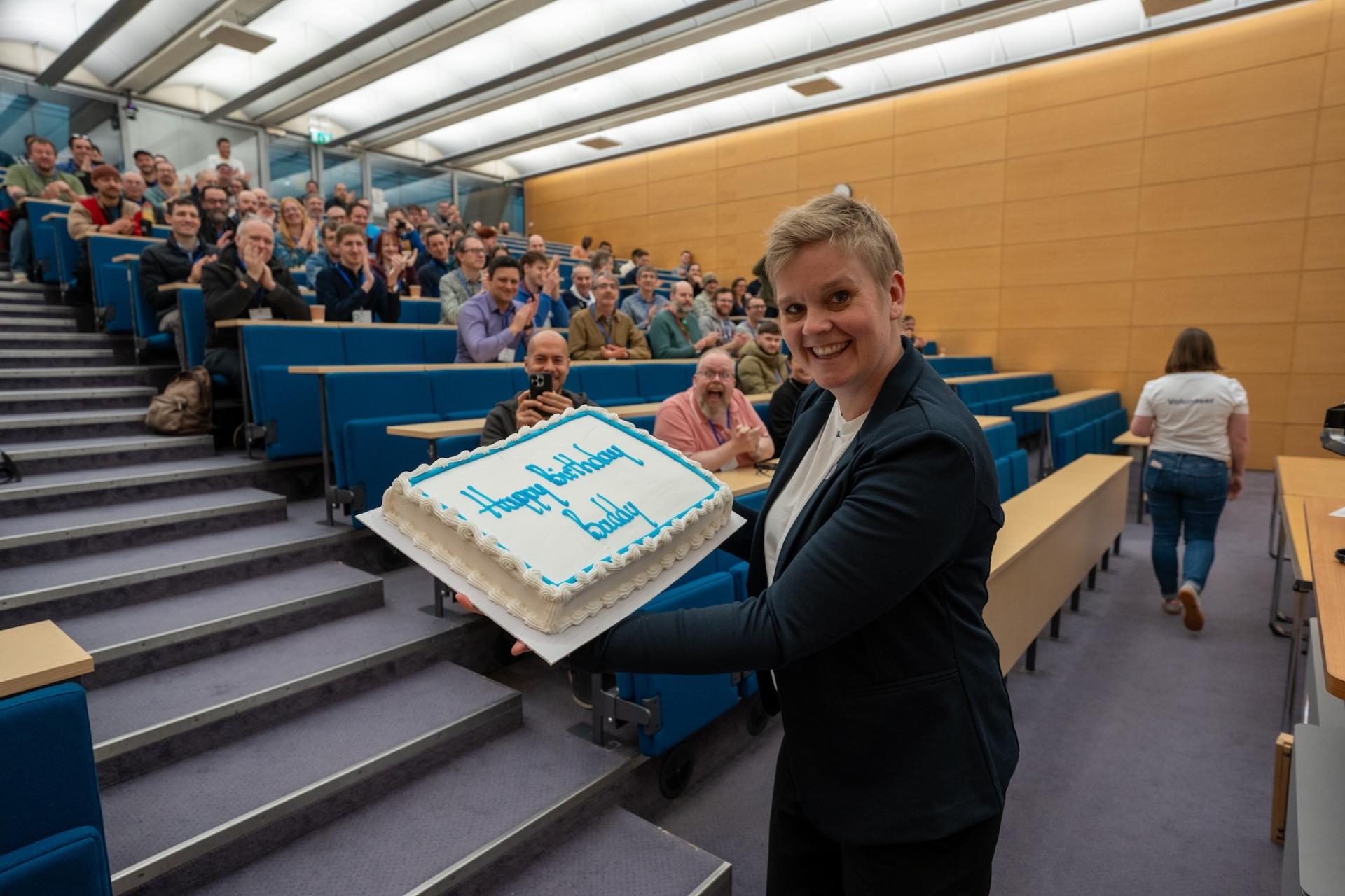Baddy Sonja Breidert, CEO and Co-founder at 1xINTERNET and a member of the Drupal Association Director Board with a surprise birthday cake presented to her while on the camp