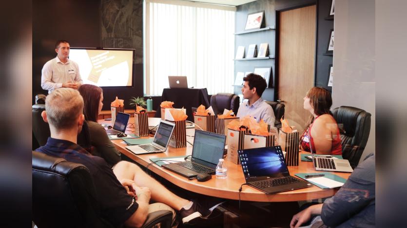 people attending a training session around a conference desk