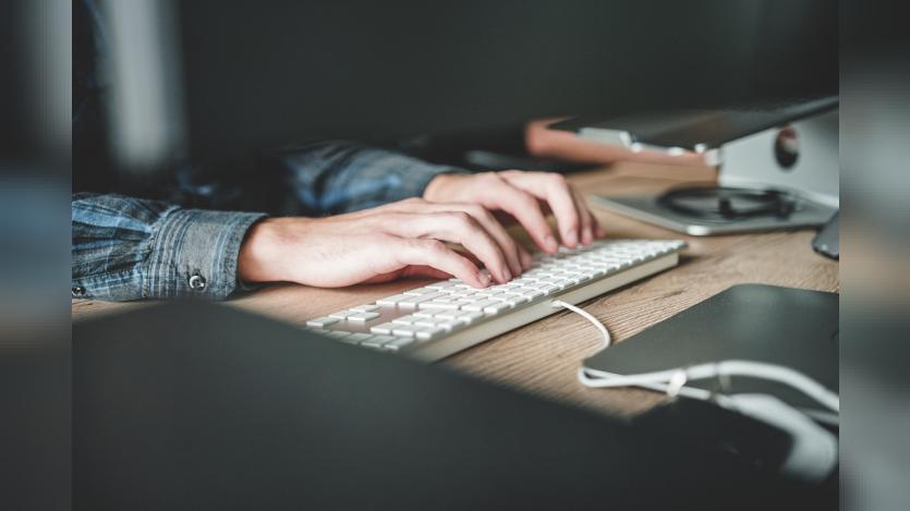 A person using computer keyboard
