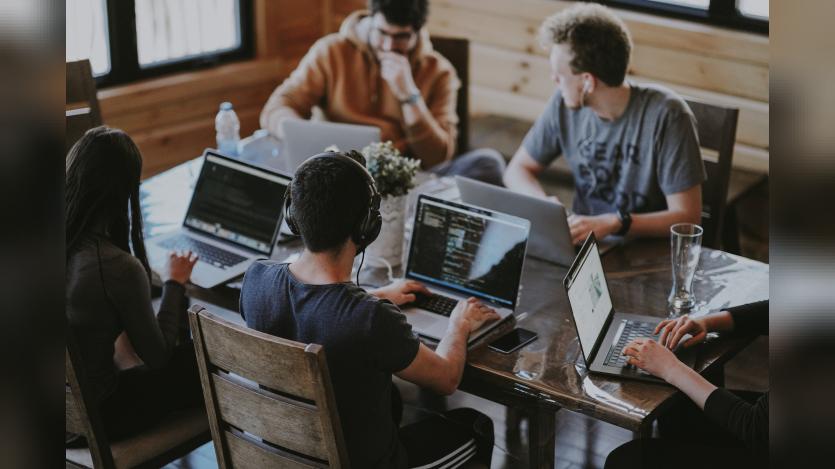 group of people working on their laptops