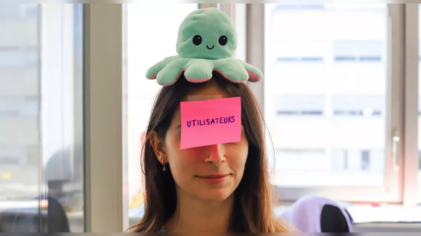a woman with a sticky note on her forehead