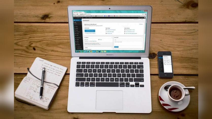 laptop on wooden table