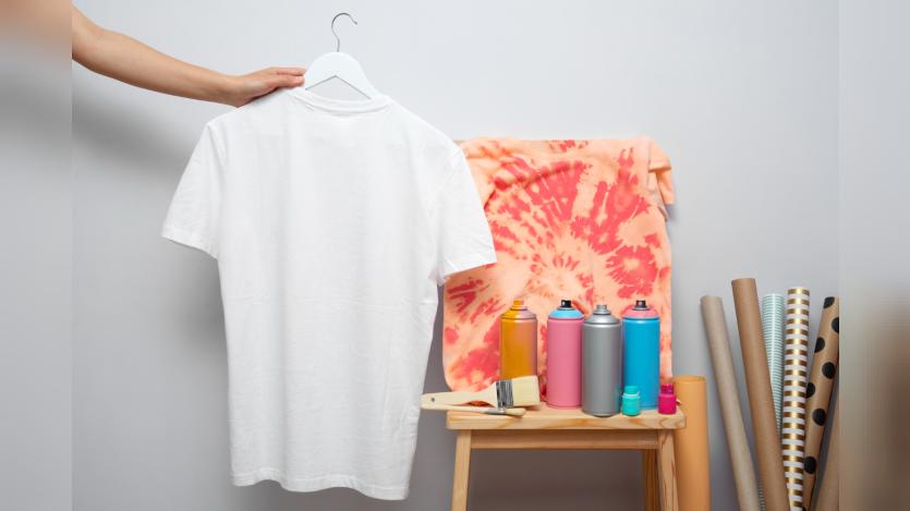 front view artist holding t-shirt