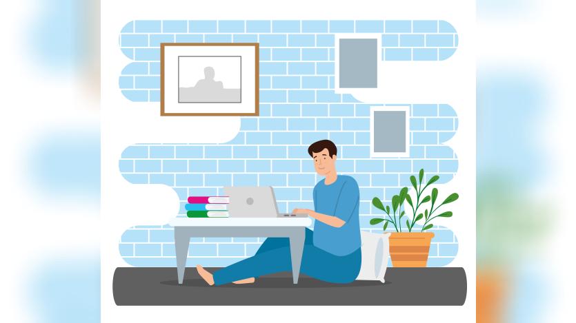 Young man stay at home using laptop