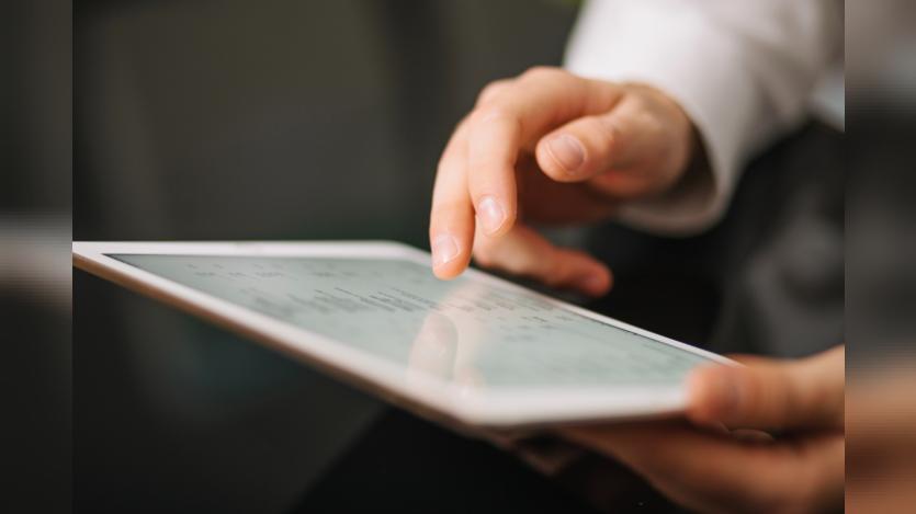 Hand of worker using tablet