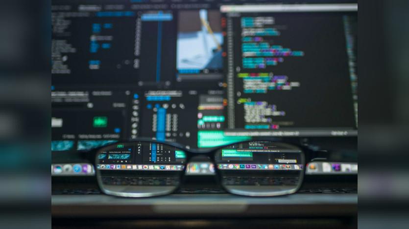 A blurred workstation focused through a reading glass. Photo: Kevin Ku