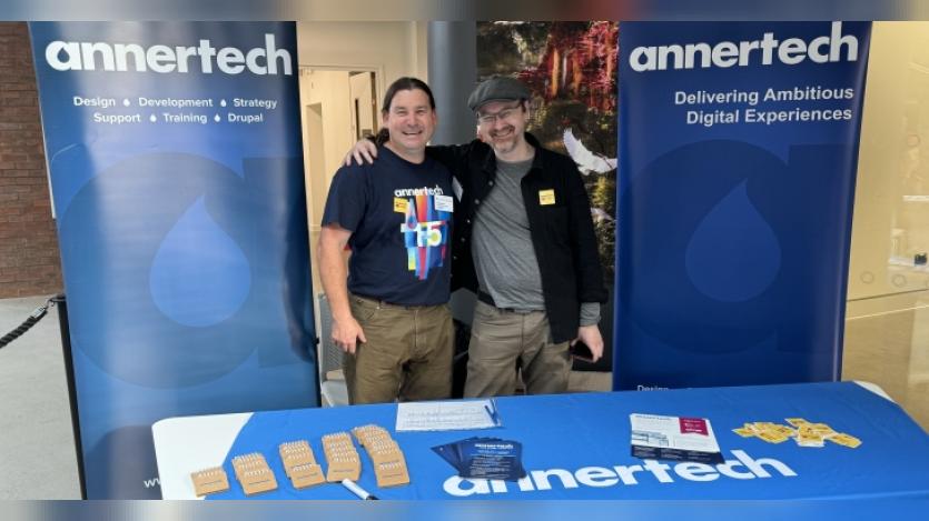 Developers Simon White and Daniel Pickering set up the Annertech booth at LocalGovCamp 2024