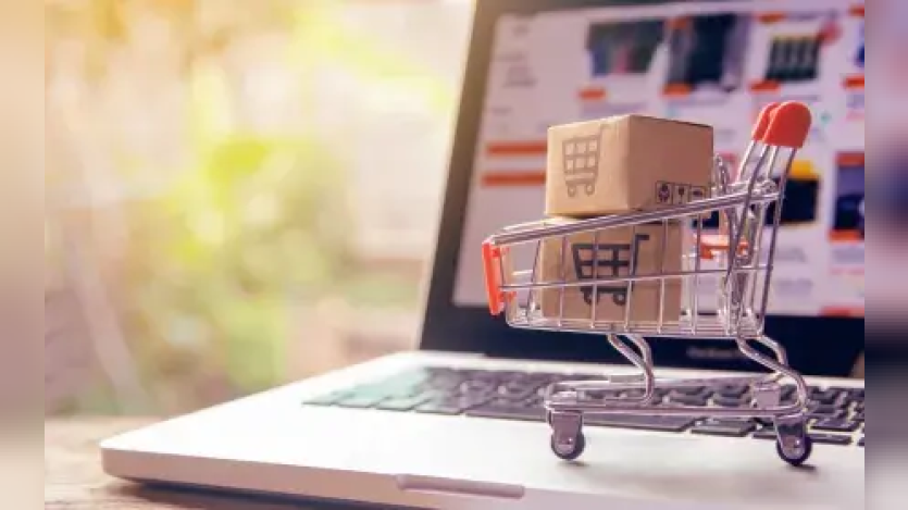 miniature shopping cart on a laptop