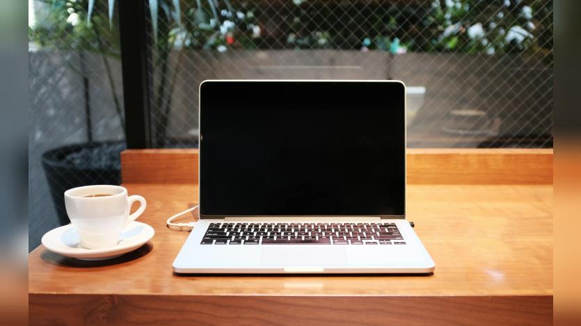 White cup and MacBook