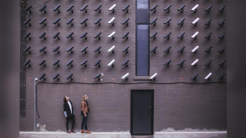 Women look at security cameras