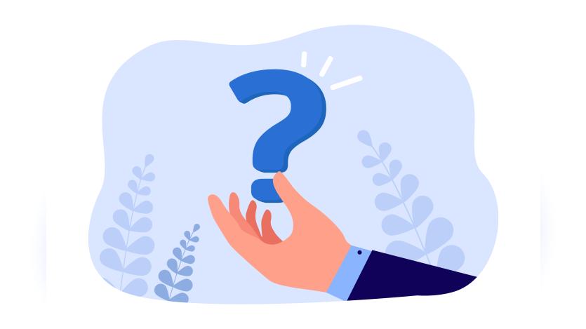 Business man's hand holding a question mark