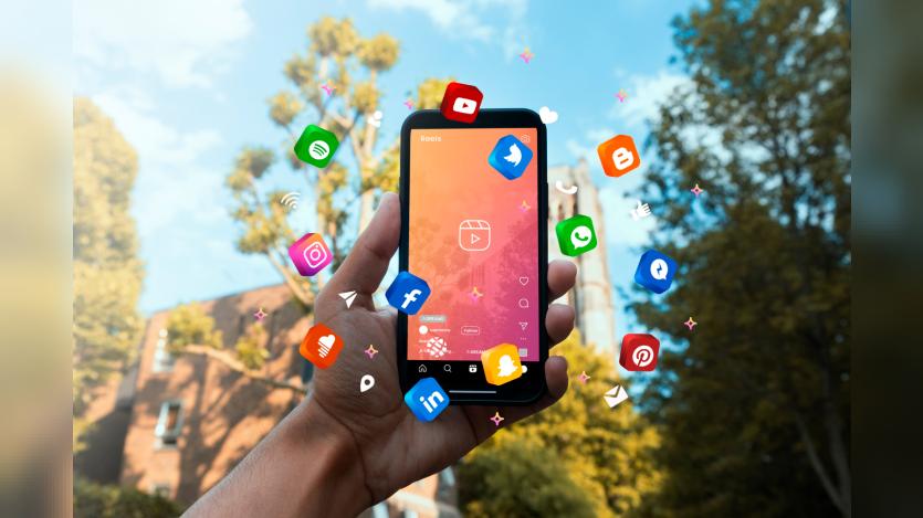 Hand holding smartphone social media concept