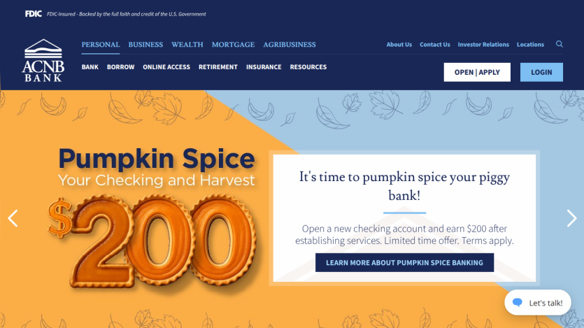 ACNB Bank homepage promoting a $200 pumpkin spice checking account offer with navigation and login options