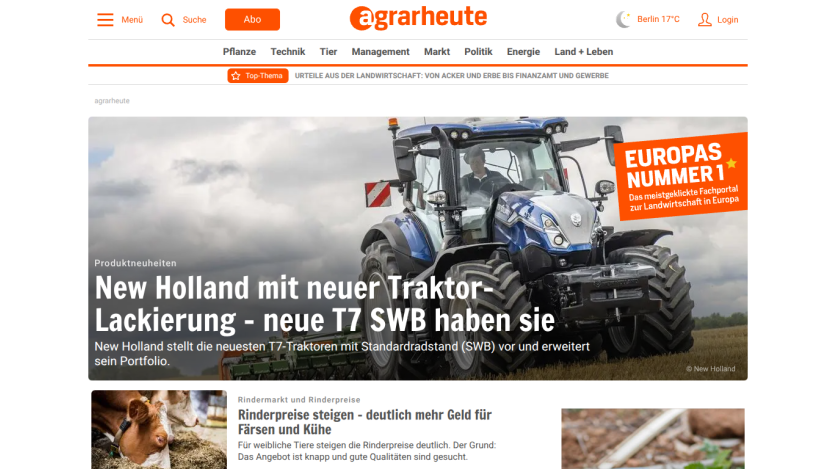 Homepage featuring a New Holland tractor article and navigation options.