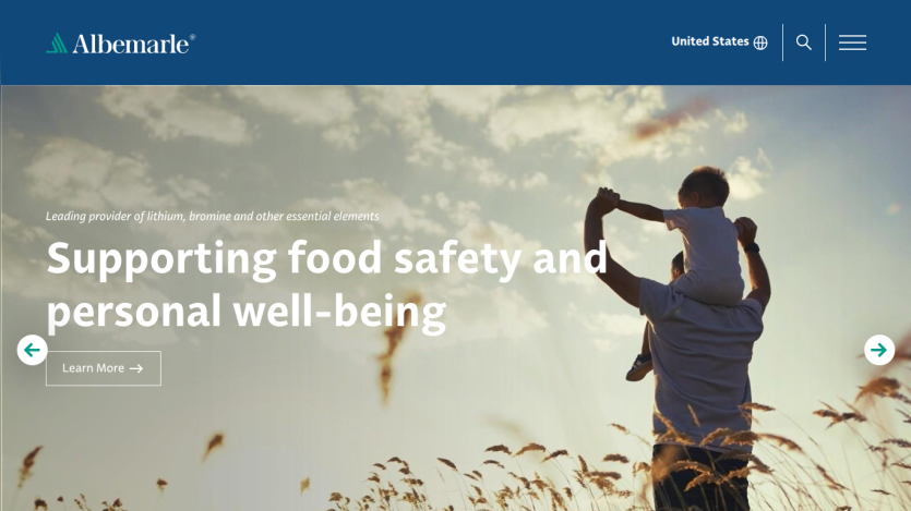 Albemarle website hero section promoting food safety and personal well-being with a man carrying a child in a field