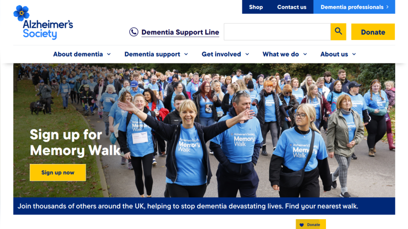 Alzheimer's Society homepage promoting the Memory Walk with a group of participants in blue shirts.