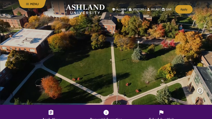 Aerial view of Ashland University's campus with trees and pathways.