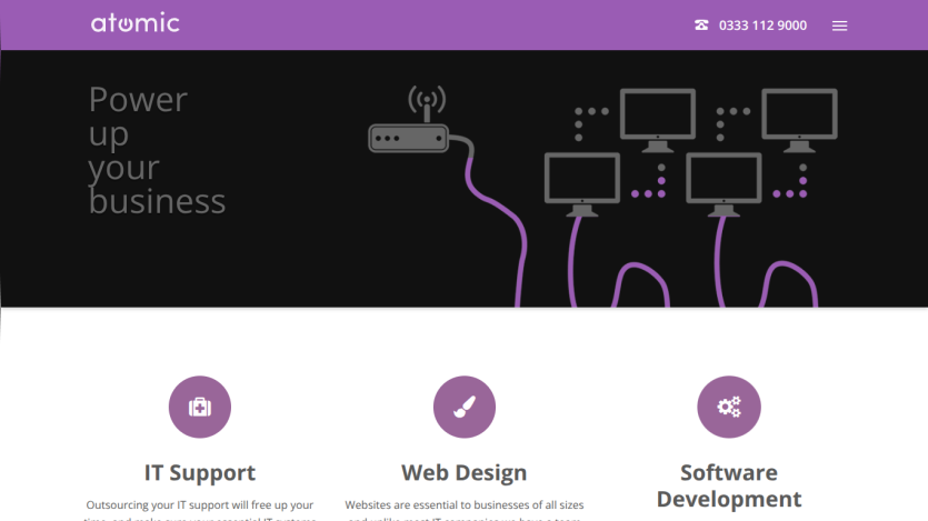 Atomic website header with contact number and hero section promoting business IT support, web design, and software development services