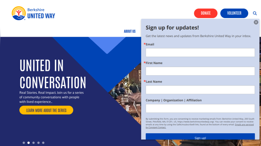 Homepage with navigation bar, large hero image of a mountain landscape, and headline 'Explore the World with Us'