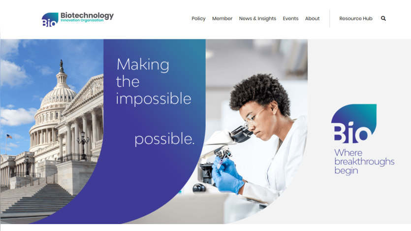 Biotechnology website featuring a Capitol building and a scientist at work, promoting breakthroughs.