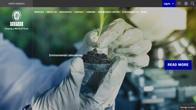 Bureau Veritas North America website with navigation and hero image of gloved hands holding a plant seedling in soil