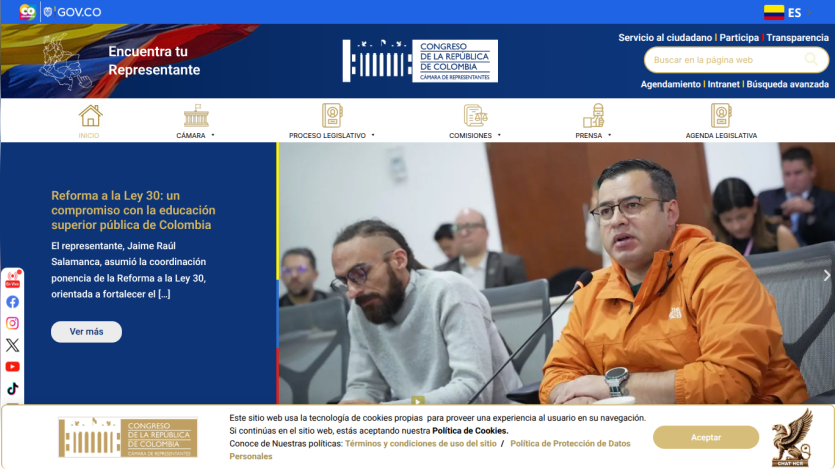Colombian Congress website with navigation menu, search bar, and featured article on education reform with image of people in meeting