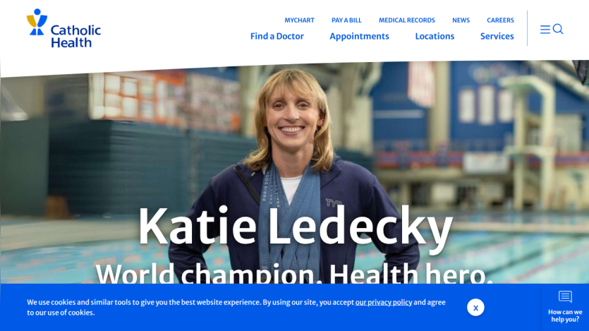 Catholic Health homepage featuring Katie Ledecky with navigation links and a cookie consent banner