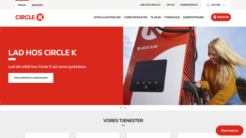 Circle K website hero promoting electric car charging with a call to find nearest charger and a woman using a charger