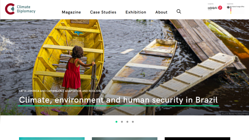 Website header with navigation and hero section showing a child in a yellow boat with text on climate, environment, and human security in Brazil