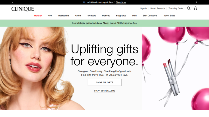 Clinique homepage featuring a smiling woman and promotion for uplifting gifts with pink balloons and a shop all gifts button