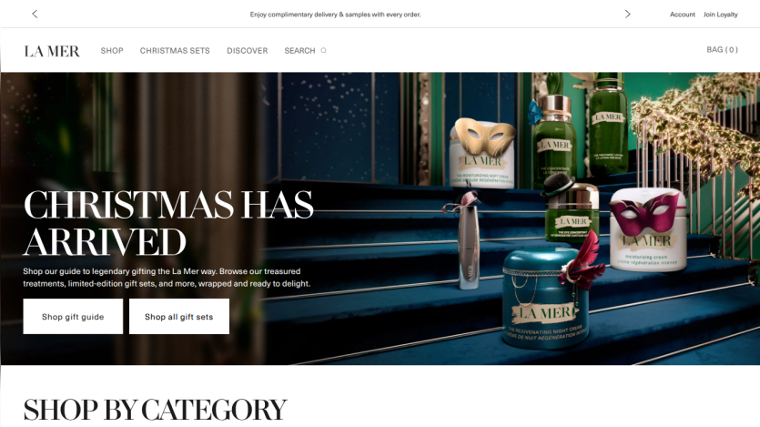 La Mer website hero section promoting Christmas gift sets with product images and shopping options