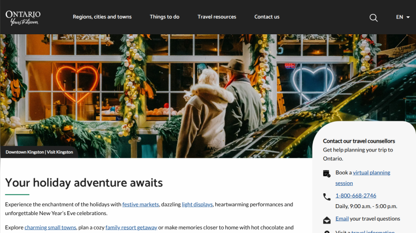 Ontario tourism website featuring a couple in winter attire with holiday lights, promoting holiday adventures and travel experiences