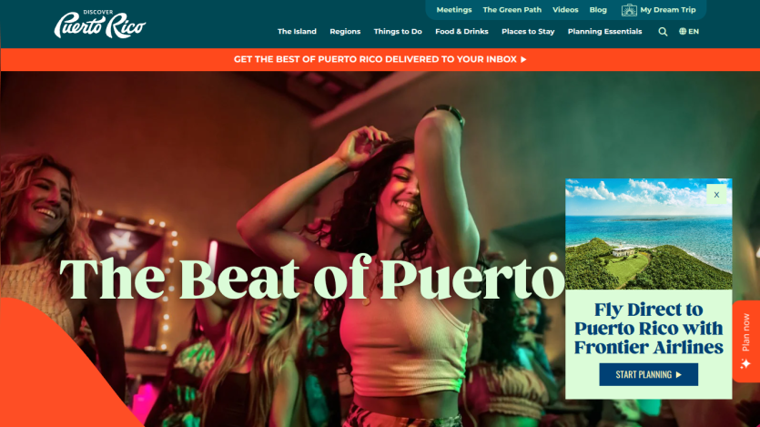 Vibrant scene showcasing dancing people with the text 'The Beat of Puerto Rico' prominently displayed.
