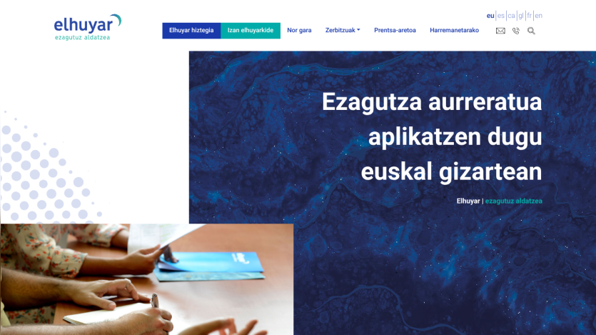 Homepage featuring a blue background with text about applications in Basque society.