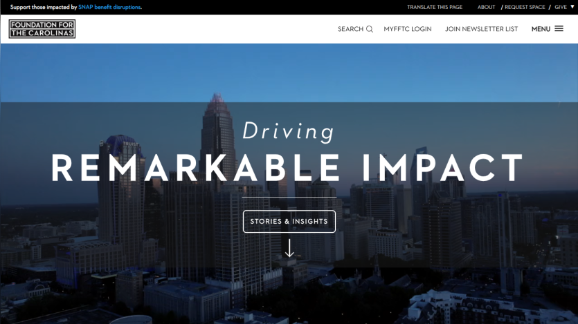 Foundation for the Carolinas website with a city skyline background and text Driving Remarkable Impact