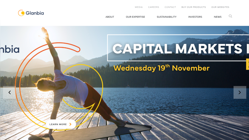 Glanbia website with navigation menu and hero section featuring a person exercising by a lake and event date Wednesday 19th November