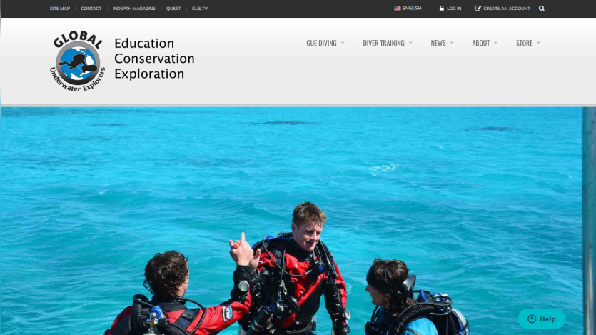 Global Underwater Explorers website header with navigation and hero image of three scuba divers in clear blue water