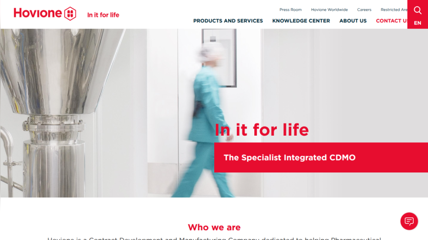 Hovione website hero section with slogan 'In it for life' and 'The Specialist Integrated CDMO' text, navigation menu visible.