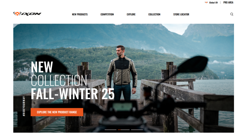 Homepage showcasing new Fall-Winter 25 collection with a man standing on a dock by a lake and mountains in the background