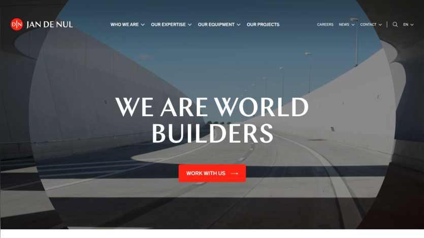 Website header with navigation and hero section stating 'We Are World Builders' and a red 'Work With Us' button