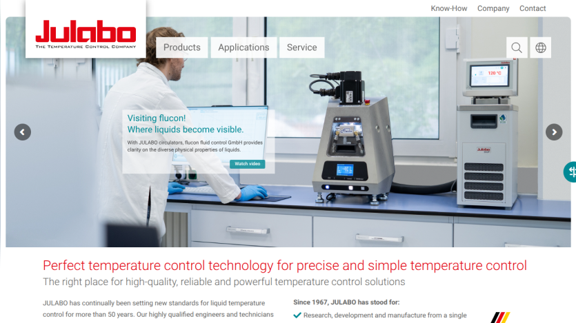 Julabo homepage showcasing temperature control technology with a scientist using equipment and product highlights