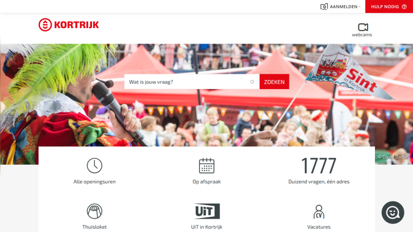 City of Kortrijk website with search bar, event info, and navigation icons under a festive crowd photo