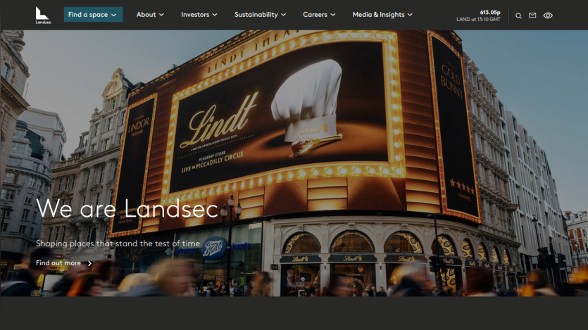 Lindt store exterior with large illuminated sign and headline 'We are Landsec' describing property ownership