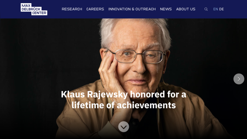 Homepage featuring Klaus Rajewsky honored for achievements with navigation links.