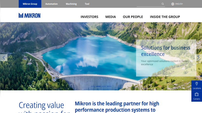 Mikron homepage with navigation, hero image of a dam and lake, and text about business solutions and high performance production systems