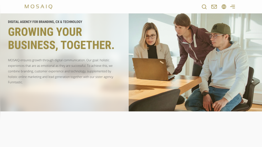 Digital agency homepage with headline 'Growing your business, together' and team collaborating around a laptop