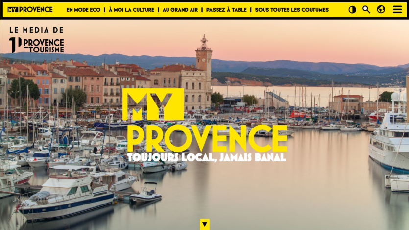 Tourism website for Provence featuring a harbor view with boats and a sunset, highlighting local travel and experiences