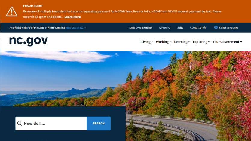 North Carolina government website homepage with scenic mountain road image and search bar