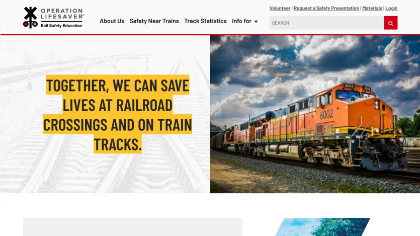 Operation Lifesaver homepage with message about saving lives at railroad crossings and an image of an orange train under a cloudy sky
